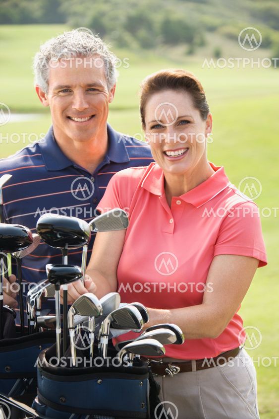 Couple on golf course.