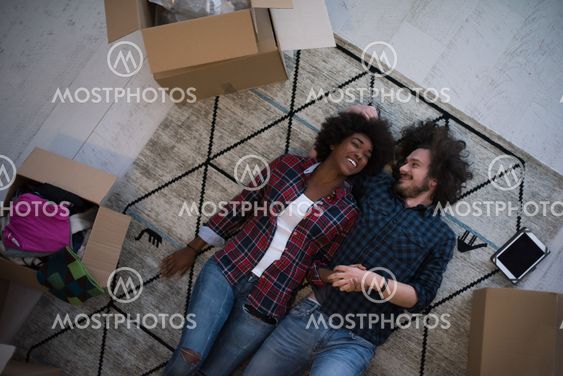 Top view of attractive young multiethnic couple