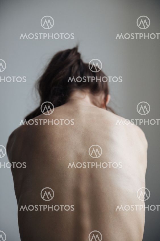 Back view of naked woman