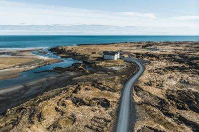 aerial view of houses and road on seashore, snaefellsnes,...