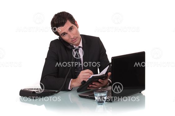 A businessman taking an appointment.