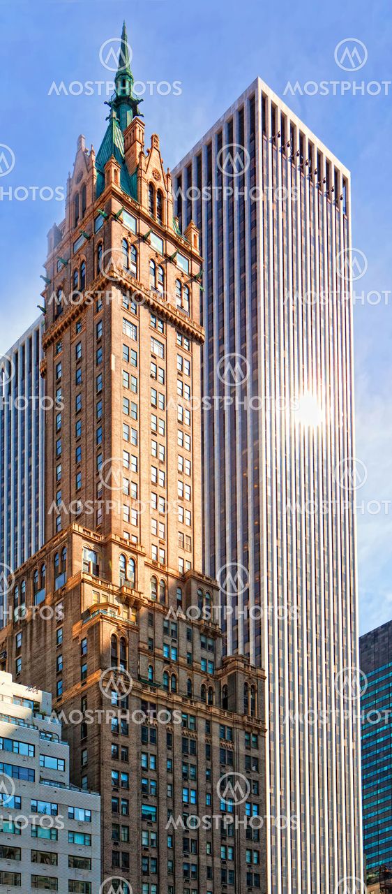 Mahhattan .Urban view at modern glass building with blue sky
