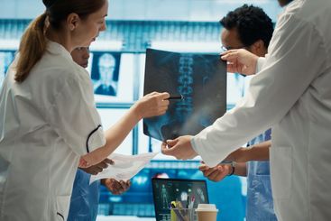 Doctors analyze human anatomy scans in a treatment center