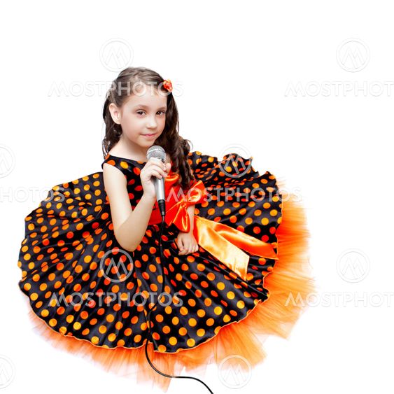 Little girl in orange peas dress with microphone