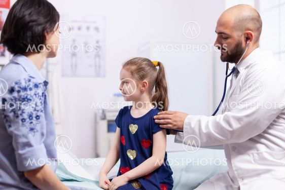 Little child having consultation-hour in medical office