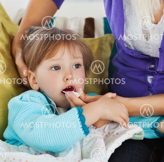 Mother taking care of her pretty child