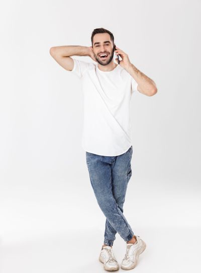 Full length of a handsome cheerful man