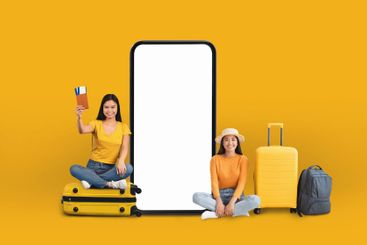 Travelers girlfriends next to huge smartphone mockup