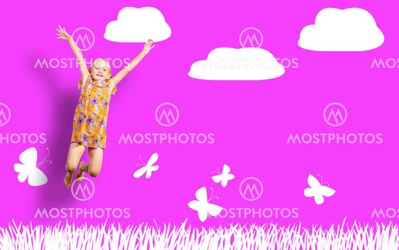 Girl jumping in a color dress