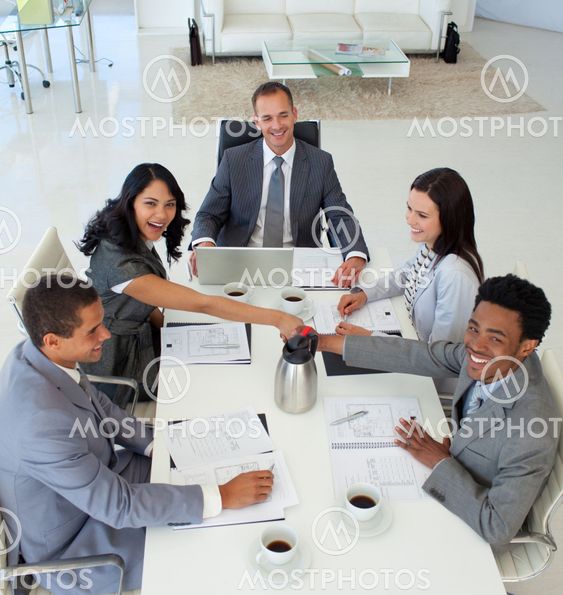 Business people shaking hands in a meeting
