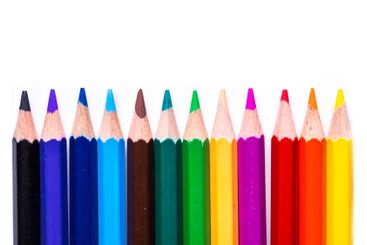 Colorful set of pencils arranged in a row showcasing a...