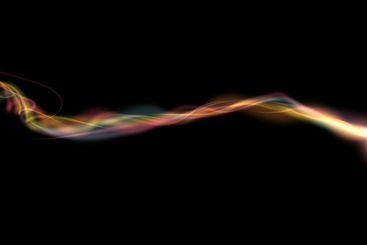 Multi colored plume of smoke, black abstract background....