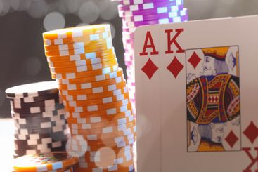 Poker game set of cards and chips close up