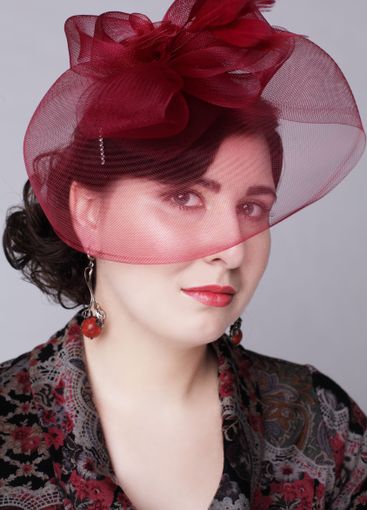 Elegant brunette woman in red hat retro style fashion...