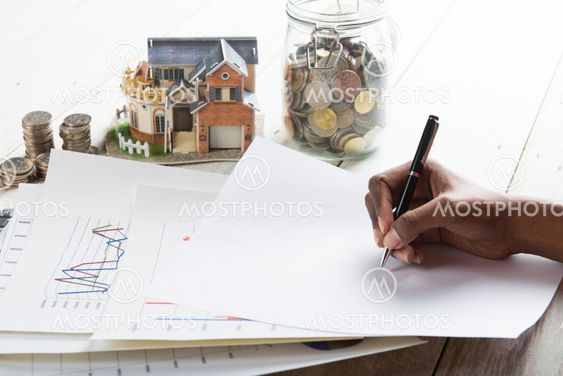hand signing property loan agreement concept