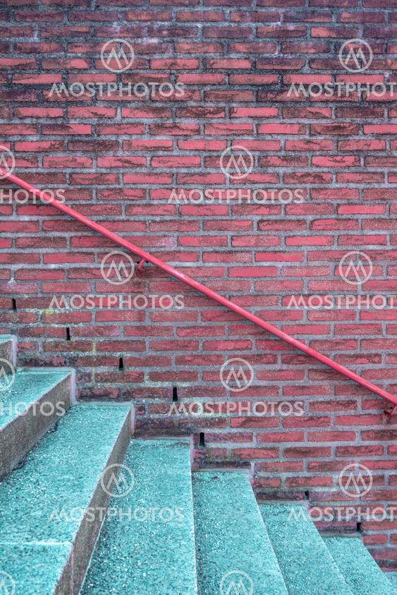 Stairway and brick wall with handrail