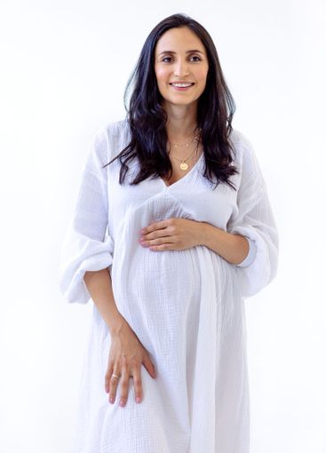 Portrait of an attractive young pregnant woman in a...