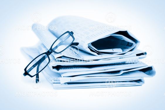 Newspapers and black glasses