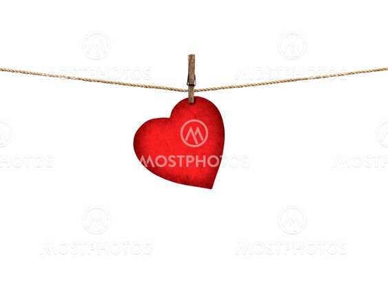 Valentine card heart shaped from old red paper hanging on...