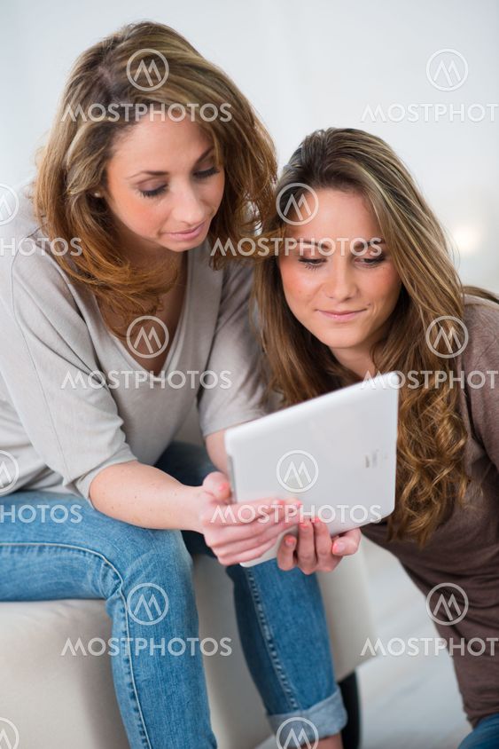 portrait of two beautiful girls at home