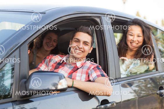 Boys and Girls in a Car Leaving for Vacation