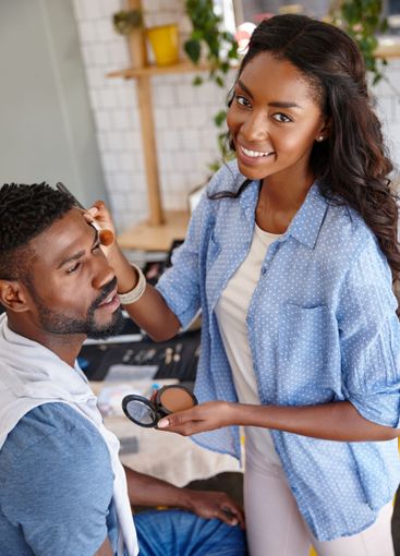 Makeup artist, beauty and brush with black people in...