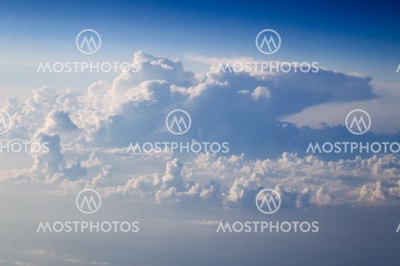 dramatic blue sky with clouds and sun rays