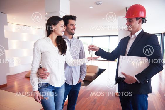 couple buying new home with real estate agent