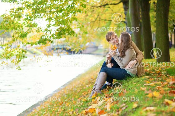 Dating couple on the river bank
