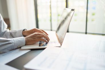 Business man working using laptop computer Hands typing...