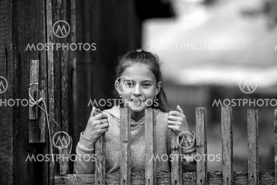 Rural teen girl, black and white portrait outdoors.