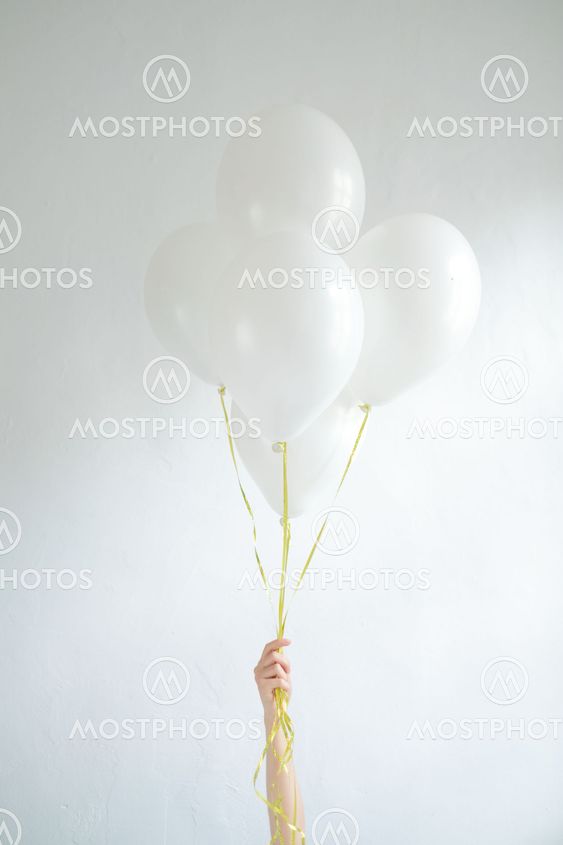 Hand hold blank white balloon mock up isolated