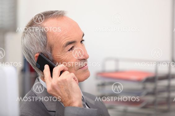 Senior man receiving call