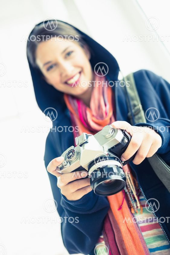 Attractive brunette holding her camera
