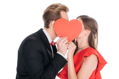 couple with red paper heart