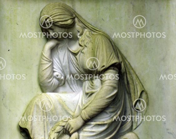 detail of an old marble fombstone