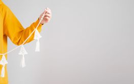 Handmade crochet new year decoration in woman hands....