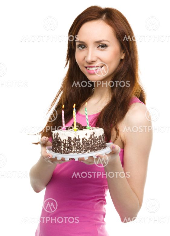 Young woman with anniversary cake