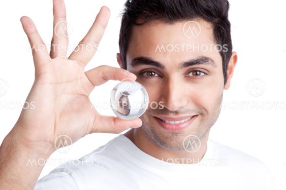 Young Man Holding Crystal Ball