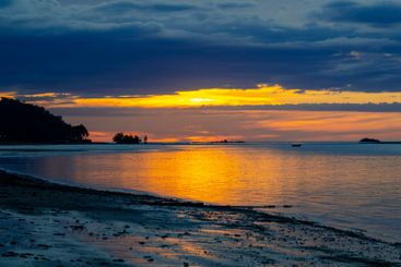 Breathtaking Evening Glow Reflecting on the Serene Seaside
