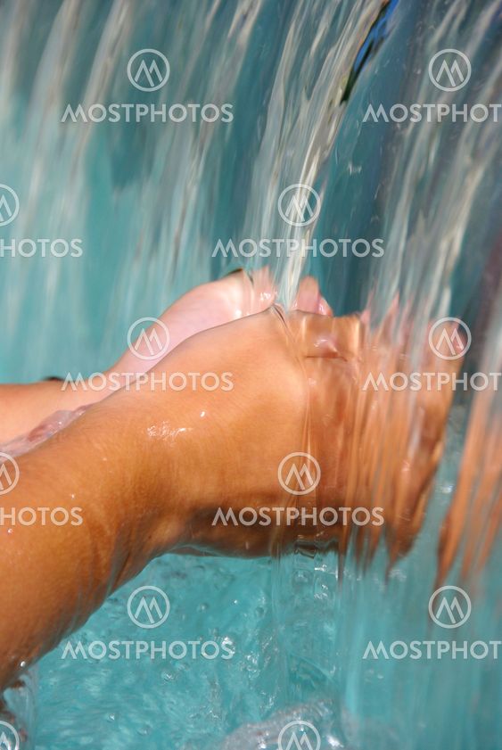 Two hands under the water