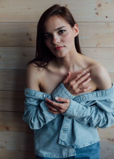 Beautiful Slim Brunette Woman in Denim Jacket Portrait