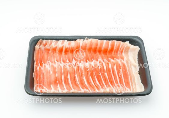 Slide of raw pork on white background .