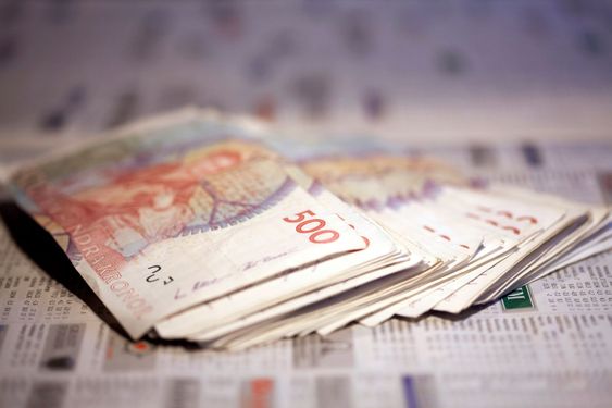 Money, banknotes on a newspaper.