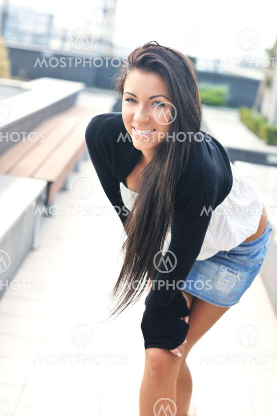 beautiful young lady posing in garden