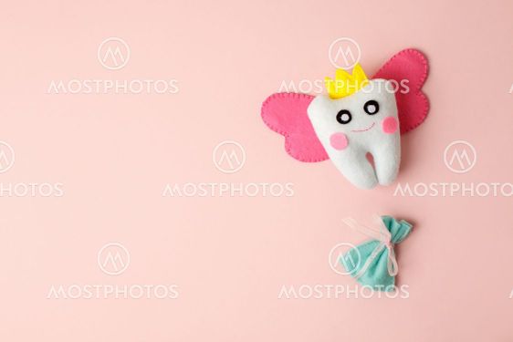 Cute toy for Tooth Fairy Day as funny smiling cartoon...