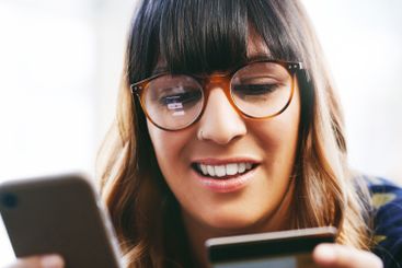 Online shopping, smile and woman with smartphone, card...