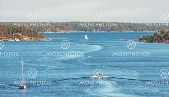 Boats trafficing the swedish archipelago outside of...