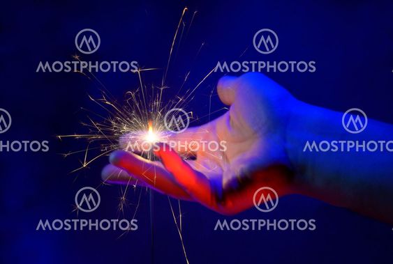 Hand Holding Fire Light Sparkler