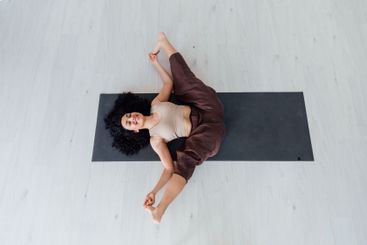 Yogi woman brunette doing asana gymnastics
